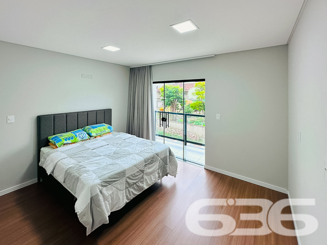 Apresentamos a você um residencial geminado tipo sobrado, recém-construído, situado no bairro Armação, na cidade de Penha, SC. Este imóvel combina sofisticação e localização estratégica, estando a apenas 150 metros da praia, oferecendo um estilo de vida exclusivo e confortável.
O design moderno é complementado por móveis planejados de alta qualidade, que estão incluídos na oferta. O sobrado é caracterizado por sua funcionalidade e elegância, com acabamentos de primeira linha que garantem beleza e durabilidade.
No térreo, encontramos uma ampla sala de estar, integrada a uma cozinha moderna, que inclui uma copa e cozinha conjugadas, criando um ambiente aconchegante e ideal para momentos em família. A área de festas, com churrasqueira e vista para o jardim de inverno, oferece um espaço perfeito para entretenimento e relaxamento.
O imóvel possui duas garagens, uma coberta e outra descoberta, garantindo comodidade para seus veículos. A residência também inclui um portão eletrônico, interfone e um sistema de alarme, proporcionando segurança e privacidade.
A área íntima, localizada no piso superior, é composta por dois dormitórios, incluindo uma suíte master com sacada, oferecendo uma vista tranquila do bairro. Os três banheiros são equipados com materiais de qualidade, destacando-se por seu design contemporâneo.
Esta residência é ideal para aqueles que valorizam a proximidade com a natureza e a tranquilidade, estando perto de escolas, serviços públicos essenciais e vias de acesso. Além disso, a estrutura permite a presença de animais de estimação, garantindo que toda a família possa desfrutar deste lar.
Venha descobrir o equilíbrio perfeito entre conforto, segurança e luxo neste imóvel de alto padrão. A 636 Negócios Imobiliários está pronta para lhe auxiliar na realização do seu sonho. Visite-nos e sinta o prazer de estar tão perto do paraíso que é a praia, num lar que é um verdadeiro refúgio de paz e sofisticação.
636 NEGÓCIOS IMOBILIÁRIOS: A SUA MELHOR ESCOLHA
Com mais de 30 anos de experiência, a 636 Negócios Imobiliários é sua parceira ideal para encontrar o imóvel perfeito. Estamos prontos para ajudá-lo a fazer deste imóvel o seu novo lar.
Telefone: (47) 3451-0636
WhatsApp: (47) 99190-0636
Não perca esta oportunidade única. Visite nosso site para mais informações: i636.com.br